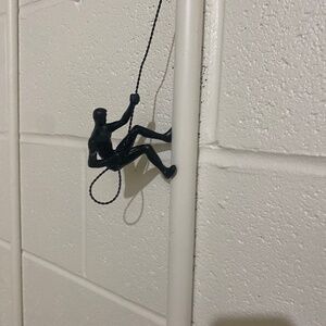 Plastic repelling man made of plastic